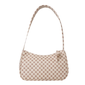 Chic vintage cream underarm bag with reddish-brown floral pattern and long shoulder strap