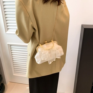 Chic white tweed shell bag with large mesh bow and pearl charms on gold chain