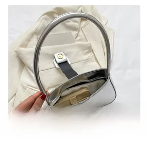 Silver metallic handbag interior view showing storage capacity for phone and wallet