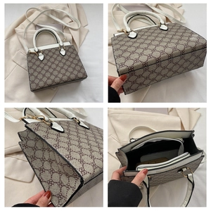 Detail view of vintage monogram tote bag with three internal storage compartments