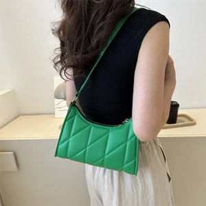 Chic quilted green baguette shoulder bag for women with minimalist faux leather design