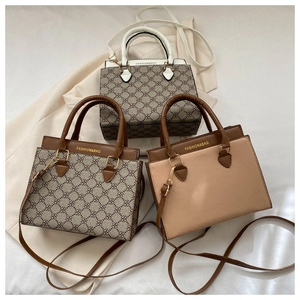 Three fashion tote bags in monogram print and solid colors with adjustable straps