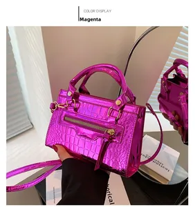 Macro detail of rose red crocodile pattern mini handbag with gold zipper and stud accents