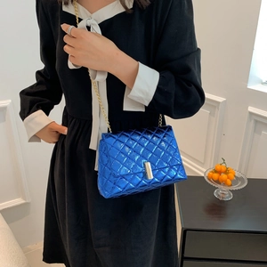 Metallic blue quilted crossbody bag with golden chain strap and silver buckle closure