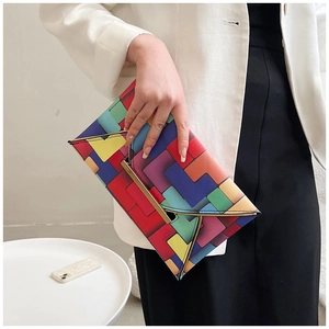 Chic envelope clutch with colorful geometric grid patterns and gold metal closure