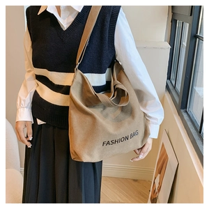 Khaki canvas tote bag with adjustable shoulder strap and Fashion Bag print detail