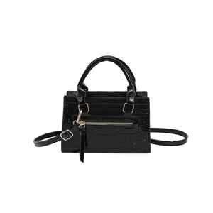 Fashionable black crocodile pattern crossbody handbag with glossy finish and gold hardware