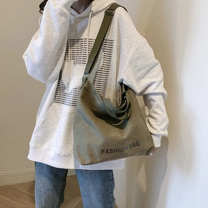 Olive green large canvas crossbody bag with adjustable wide strap for daily commute