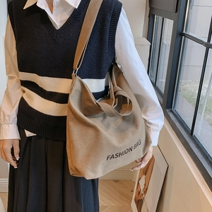 Minimalist canvas tote bag with fashion print and adjustable strap in khaki