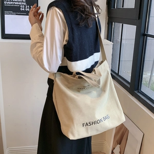 Minimalist beige canvas tote bag with long strap and fashion print for women