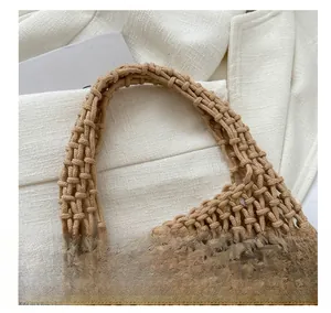 Detail of hand-woven mesh handbag showing the sturdy integrated strap and rope knotting