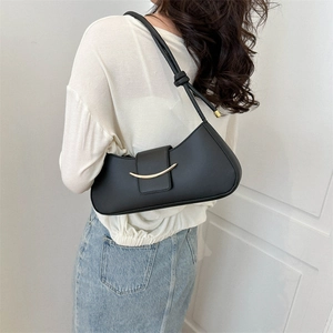 Minimalist black hobo shoulder bag with elegant gold metal bar and sleek leather finish