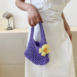 Purple woven knit handbag for women with small floral detail and minimalist chic design