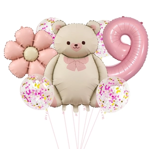 Detail of bear and daisy foil balloons with pink number 9 for 9th birthday party decor