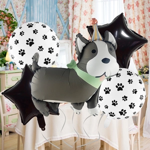 Dog party balloon set with grey pup foil balloon and star paw prints decor
