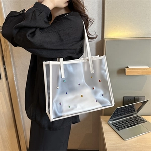 Chic white translucent frosted tote bag with colorful rivets and white leather trim