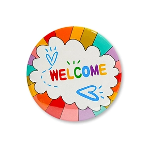 Detailed view of colorful Welcome back to school round badge with rainbow stripes
