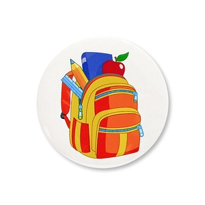 Detail of round cartoon school badge featuring a colorful backpack and red apple