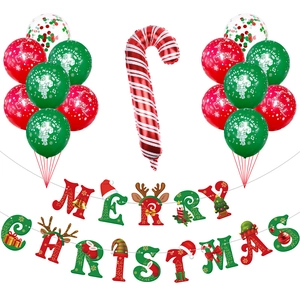 Close-up of Christmas party set with red and green latex balloons and Merry Christmas banner