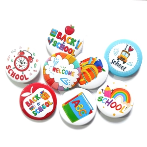 Set of 8 colorful Back to School tinplate badges with cartoon school icons and motifs