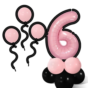 Macro detail of number 6 pink foil balloon with black latex base for 6th birthday decor