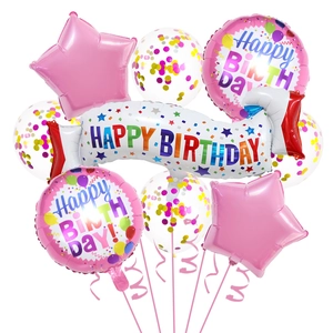 Close-up of birthday balloon set with pink foil stars and colorful confetti balloons