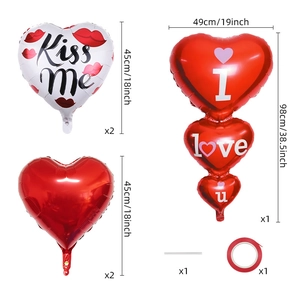 Detail view of Valentine's Day foil heart balloons with Kiss Me prints and dimensions
