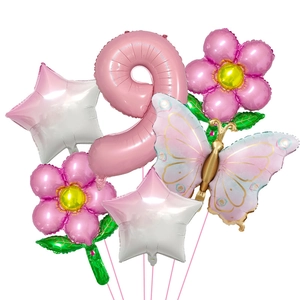 Detail of pink number 9, butterfly, and flower foil balloons for 9th birthday party decor