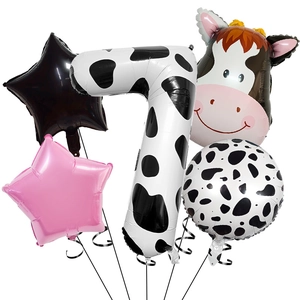Detail of cow print number 7 foil balloon set with cartoon cow head for birthday party