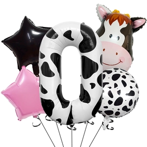 Close-up of a 5-piece cow print balloon set with a number zero and star shapes