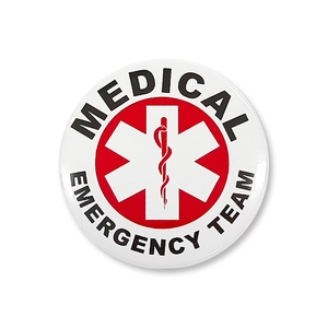 Macro shot of circular Medical Emergency Team pin badge with Star of Life symbol