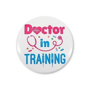 Macro detail of 'Doctor in TRAINING' tinplate badge with colorful medical icons