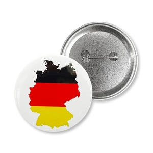 Detailed view showing the front German flag map design and metal pin back of the badge