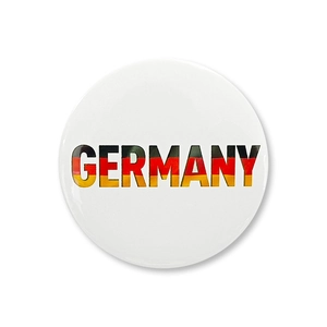 Macro shot of circular Germany badge with national flag colors and glossy finish