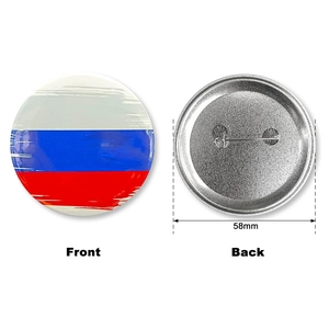 Detailed view of a 58mm tinplate pin badge showing front and back metal structure