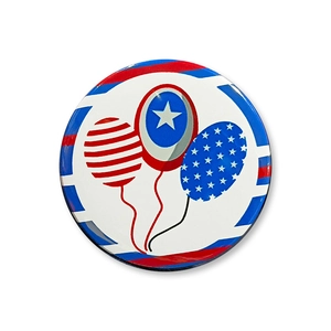 Macro shot of a tin badge with American flag style balloons and glossy epoxy finish