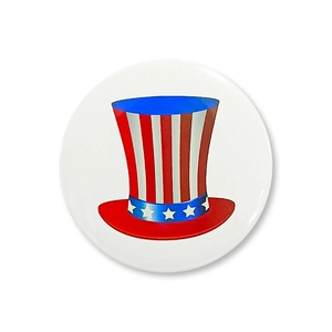 Detailed view of patriotic tinplate badge with Uncle Sam hat for Independence Day party
