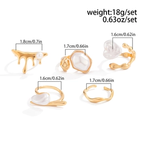 Detailed view of 5-piece gold liquid metal ring set with baroque pearls and size specs