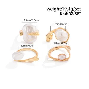 Size guide for a set of four gold-tone rings featuring baroque pearls and measurements