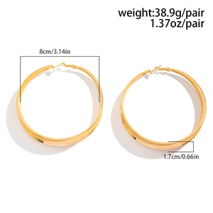 Detail view of large gold hoop earrings with dimensions 8cm diameter and 1.7cm width