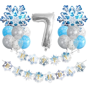 Detail of 7th birthday party set with snowflake foil balloons and happy birthday banner
