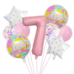 Close-up of 7th birthday candy theme balloon set with pink number and dessert graphics
