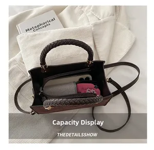 Capacity display of brown suede crossbody bag showing interior storage for phone and wallet