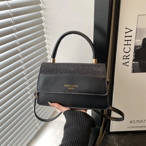 Classic black crossbody square bag with glitter flap and top handle for modern fashion