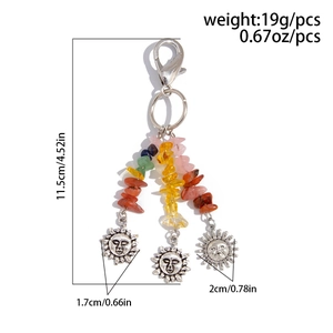 Detail showing bohemian stone keychain with silver sun charms and lobster clasp