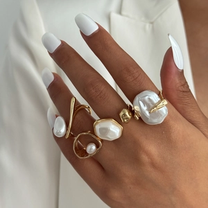 Baroque pearl ring set in gold irregular wave design worn with elegant outfit