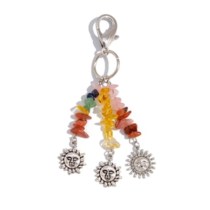 Bohemian keychain featuring colorful crushed stone pendants and sun charms on white background