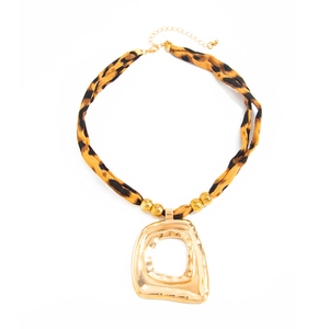 Leopard print fabric necklace with an irregular hammered gold pendant and lobster clasp