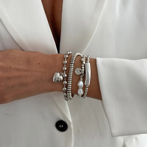 Set of four silver metal beaded bracelets with heart pendant and freshwater pearls