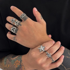 Retro silver star ring set for men featuring punk gothic designs on model hand